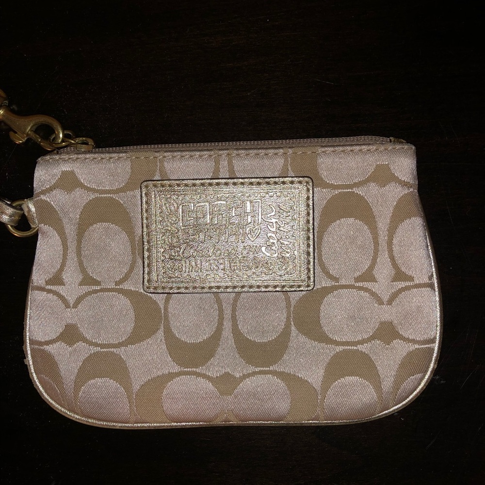Coach Poppy gold wristlet with story patch logo